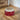 Red and white ceramic bowl with snowflake patterns on a white background