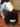 A liver and white springer spaniel eating from a dark green ceramic dog bowl made by Chow Bella