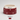 A ceramic spaniel bowl in the shade 'Mulberry' with a deep berry red exterior decorated with white stars, a cream-colored interior and rim, and the word 'Plum' printed on the front. A colour swatch block labeled 'Mulberry' is shown below.