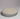 Round ceramic dish with gray rim and beige center on a white background